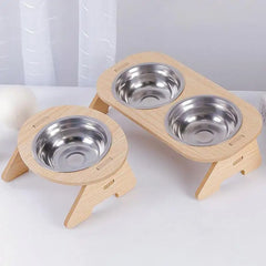 Elevated wooden pet bowl rack with 2 stainless steel bowls, tilted