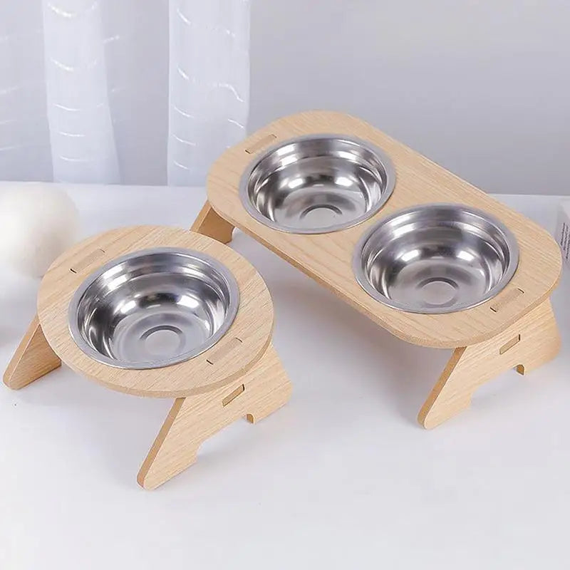 Elevated wooden pet bowl rack with 2 stainless steel bowls, tilted