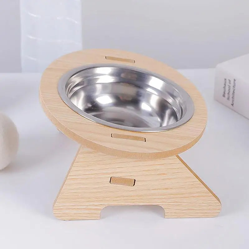 Elevated wooden pet bowl rack with 2 stainless steel bowls, tilted